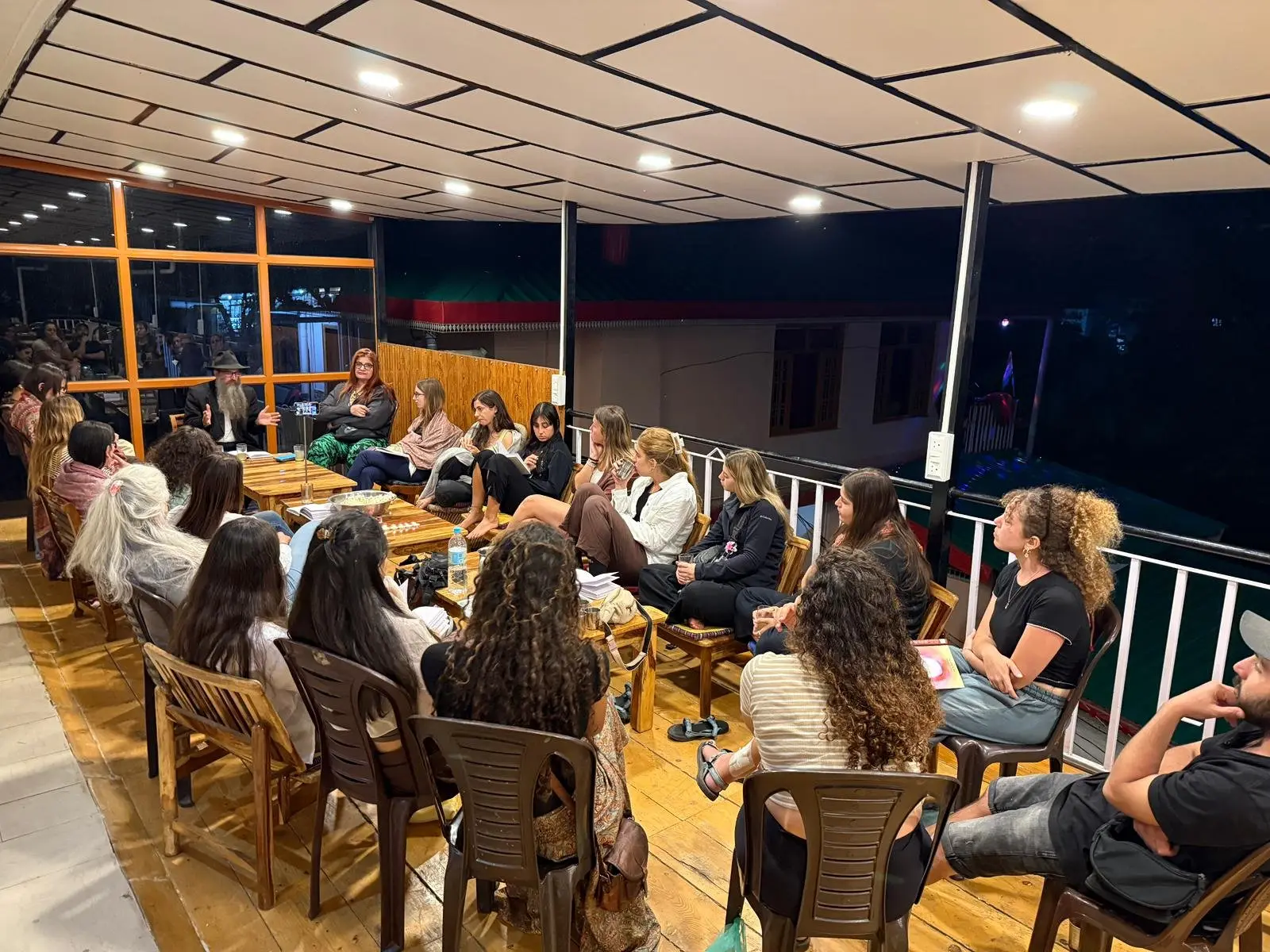 An evening Torah class on the Chabad House terrace in Dharamsala